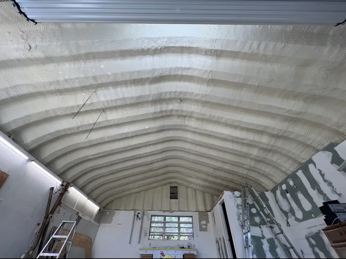 Spray polyurethane foam applied to the underside of a metal roof deck in Hollidaysburg